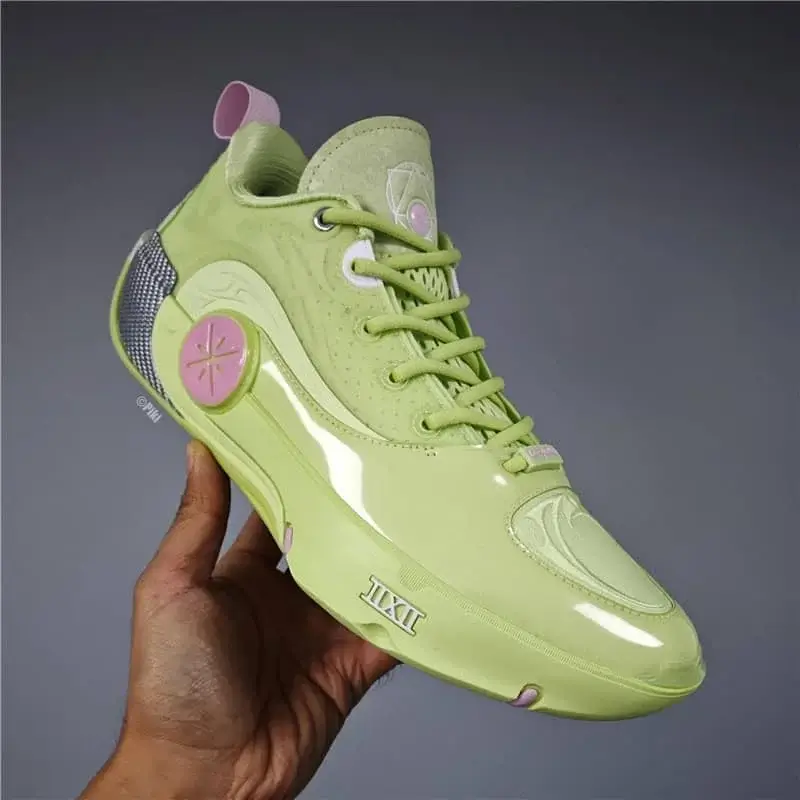 A pair of white Balenciaga chunky sneakers featuring a thick sole and mixed-material construction, with the brand’s signature logo on the side and black-and-white striped laces, delivering a bold and trendy look.